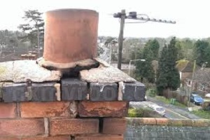 Chimney pots secured, brickwork pointed up.