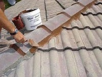 Pointing ridge tiles on a roof in Manchester